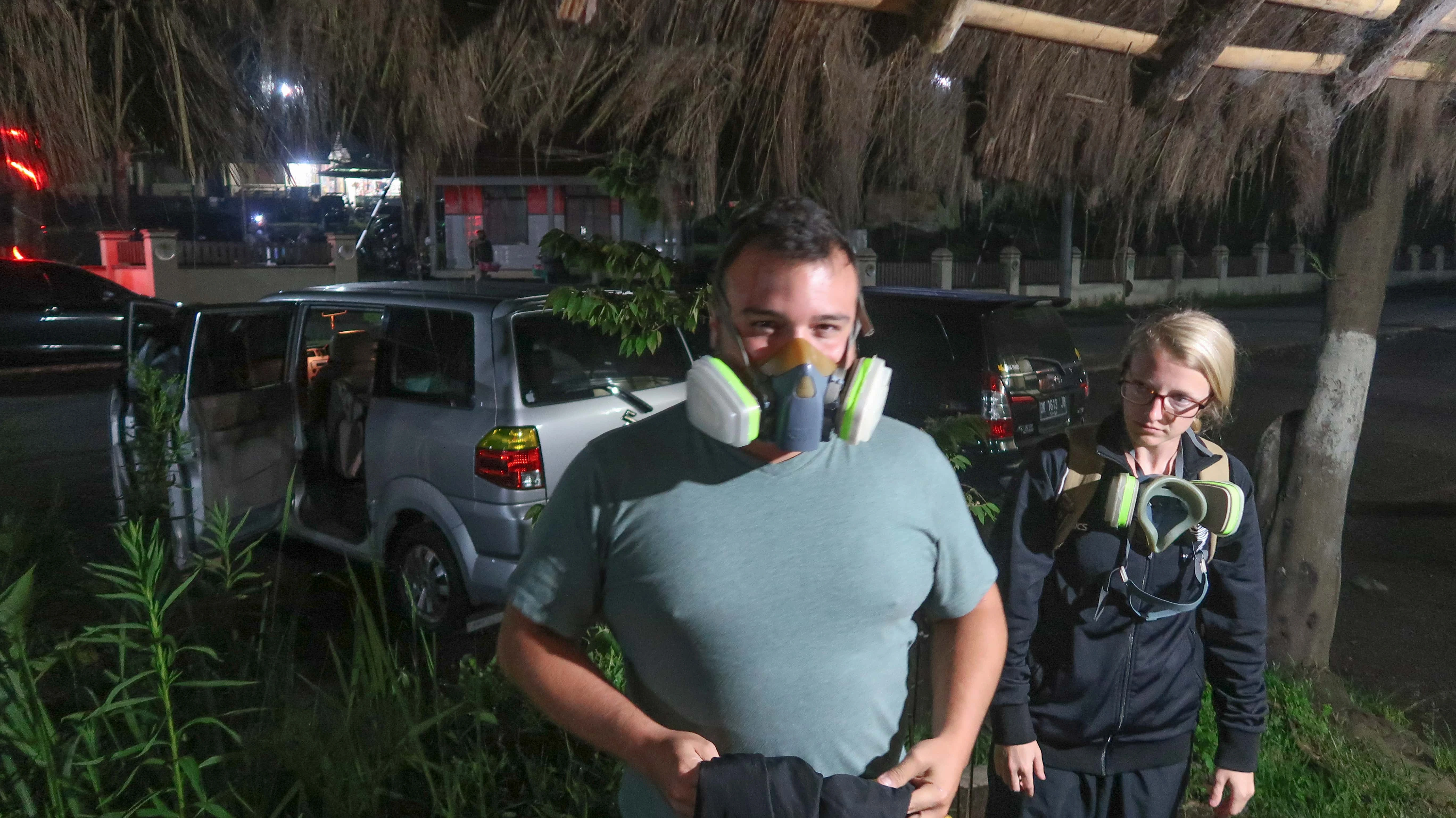 Preparing for our hike up Mt Ijen with gas masks and gloves