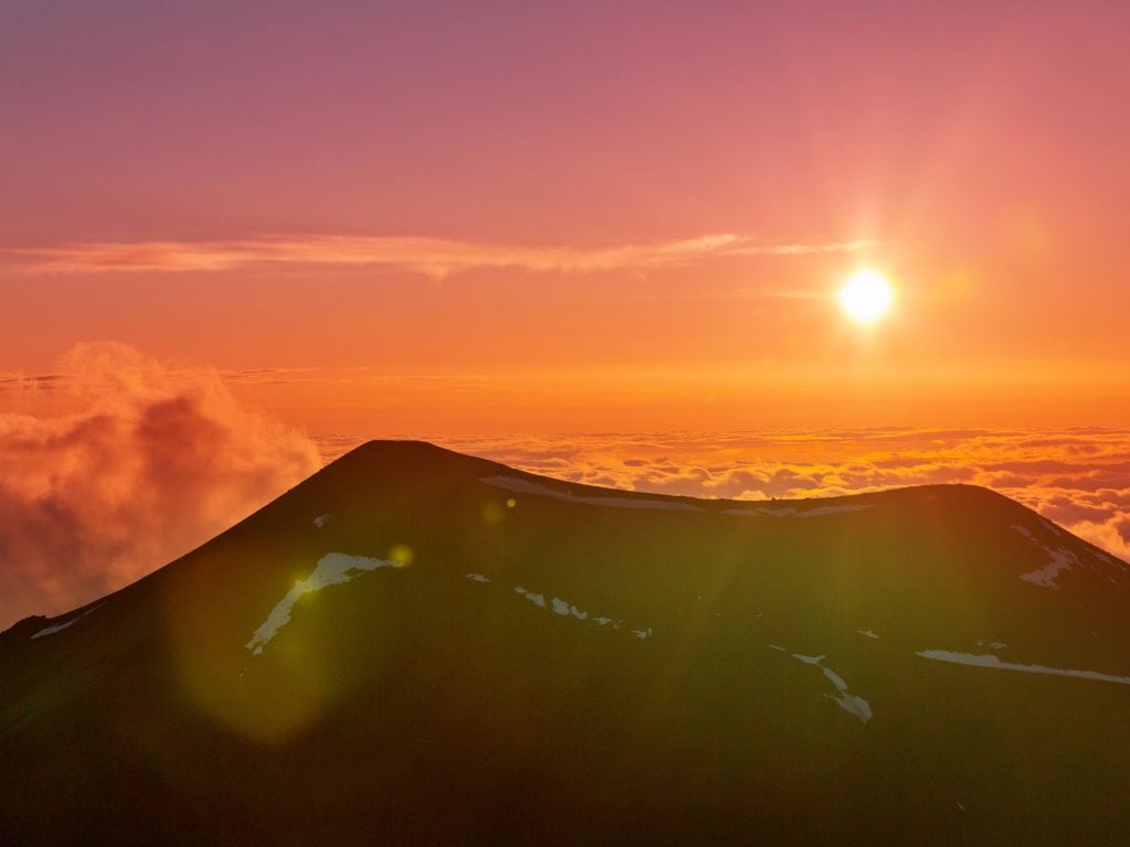 A Pink And Orange Sky Over Mauna Kea.