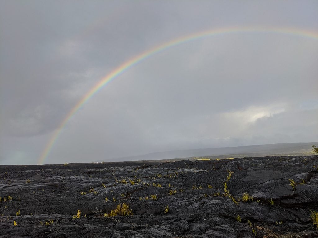 Rainbow Over The Lava Fields In Kalapana, Hawaii.