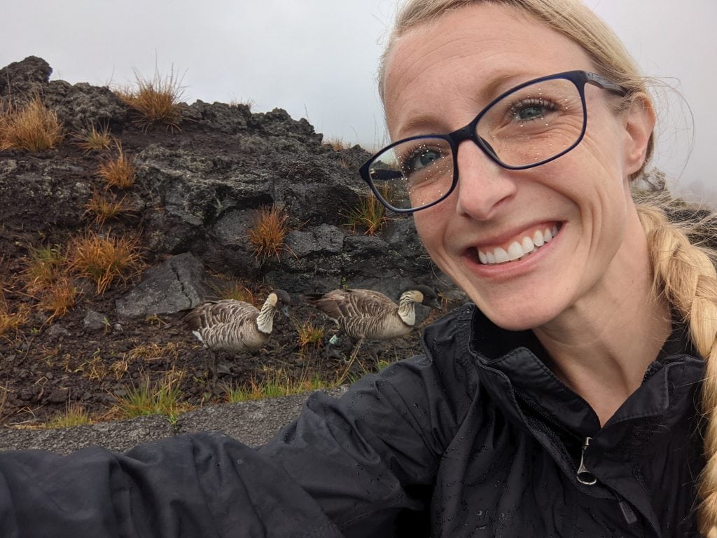 Laura With Two Nenes, The State Bird of Hawaii. Visiting Volcanoes National Park Is One of The Best Things To Do In Hilo.