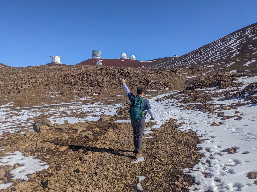 Mike during the Mauna Kea Hike with Telescopes in the Background.
