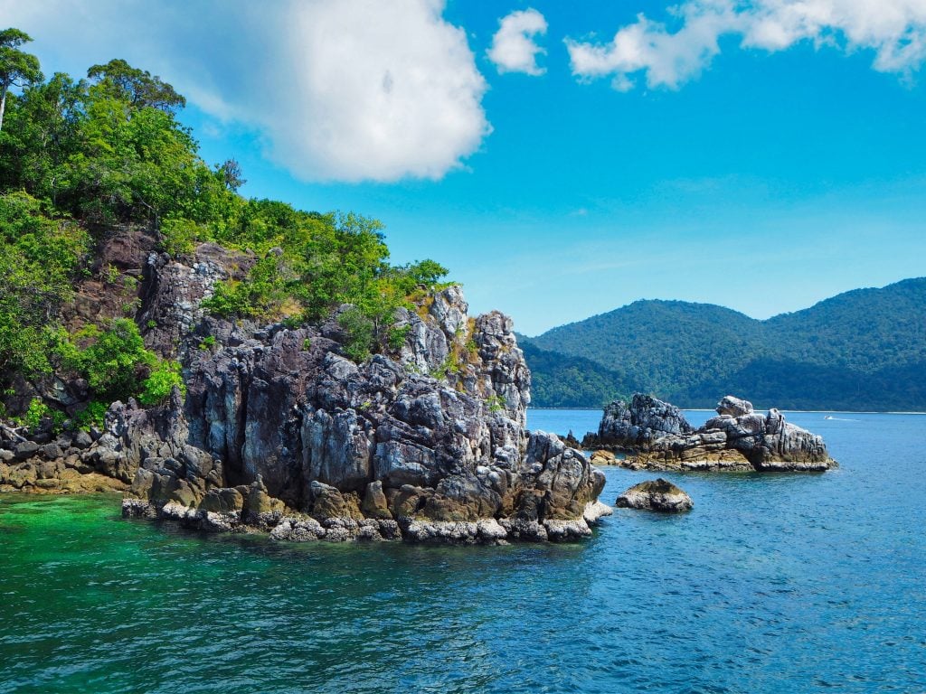 Koh Adang Rocky Coastline With Blue Skies.