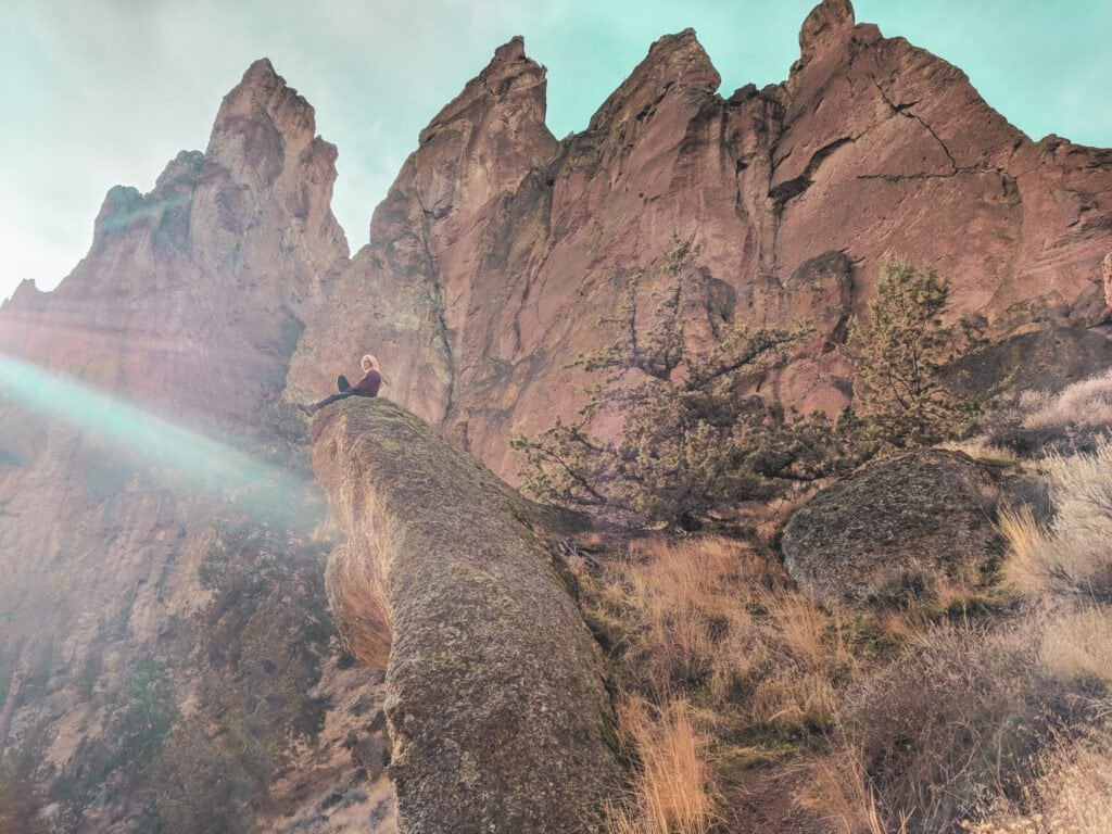 Laura Sitting Atop A Rock At Smith Rock State Park.