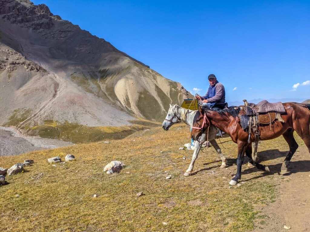 A Man Riding On A Horse In Kyrgyzstan.