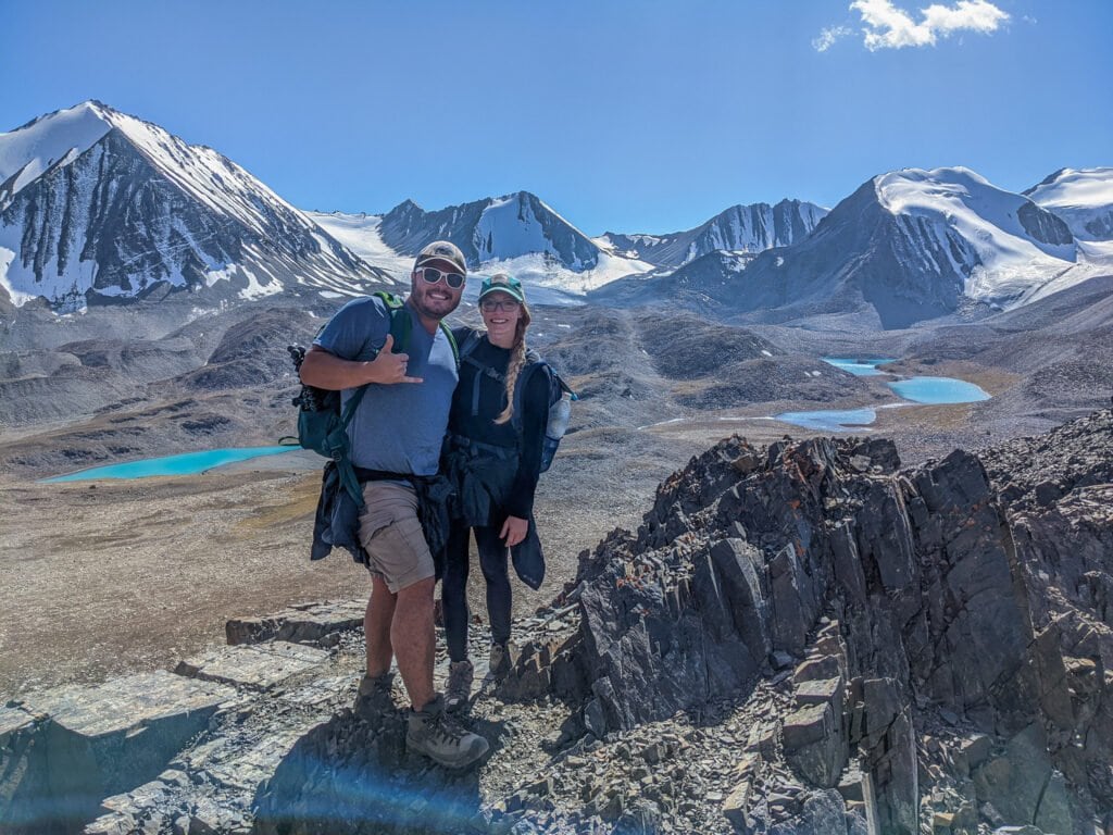 Standing On The Top of Sary Mogol Pass with Beshkol Lake In The Background.