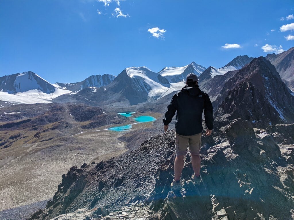 Standing On Top of Sary Mogol Pass Looking Out To Beshkol Lake