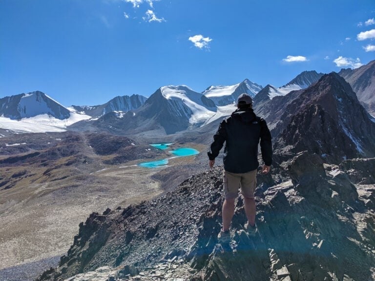 Standing On Top of Sary Mogol Pass Looking Out To Beshkol Lake