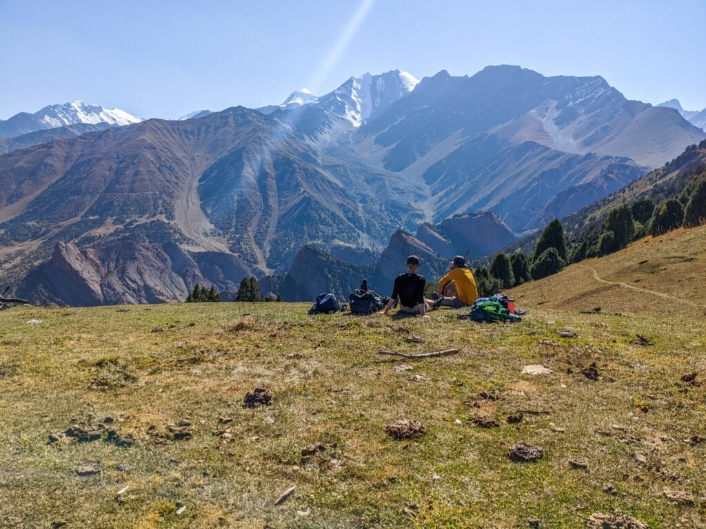 Sitting On The Edge of a Hill Looking Out To The Alay Mountains In Kyrgyzstan.