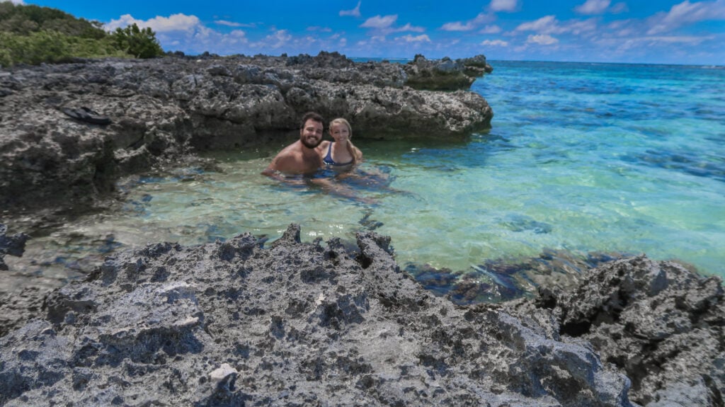 Sitting In A Tide Pool In Moorea, French Polynesia.