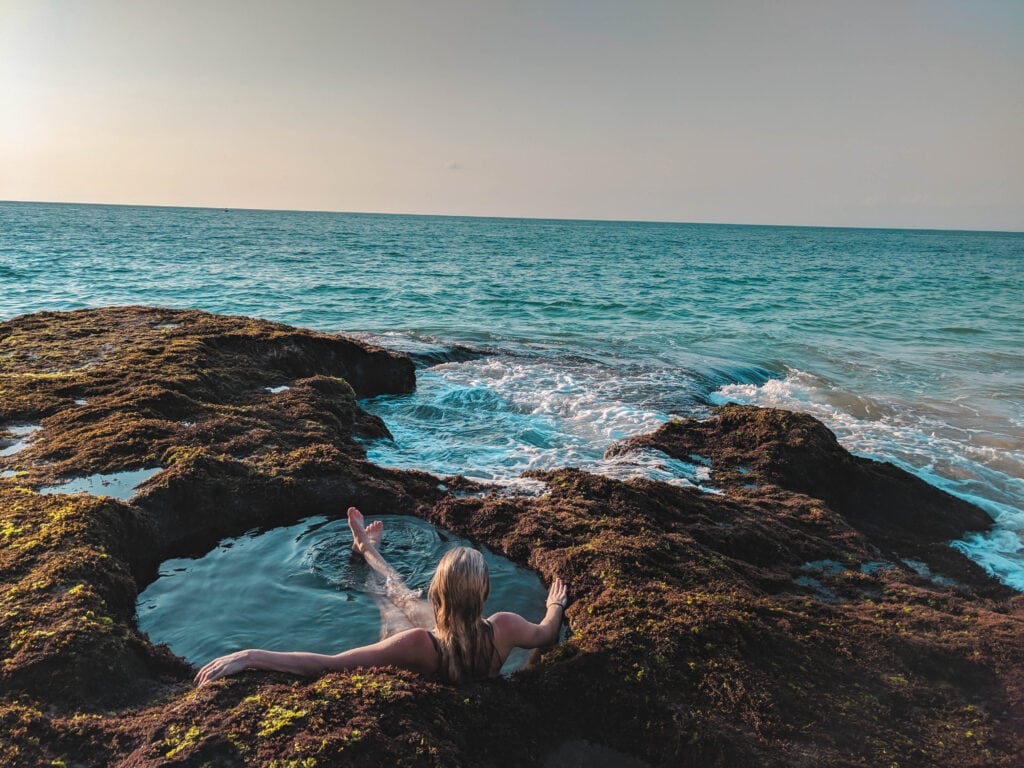 Reduce the cost of living in Bali by doing free things like sitting in these ocean jacuzzis.