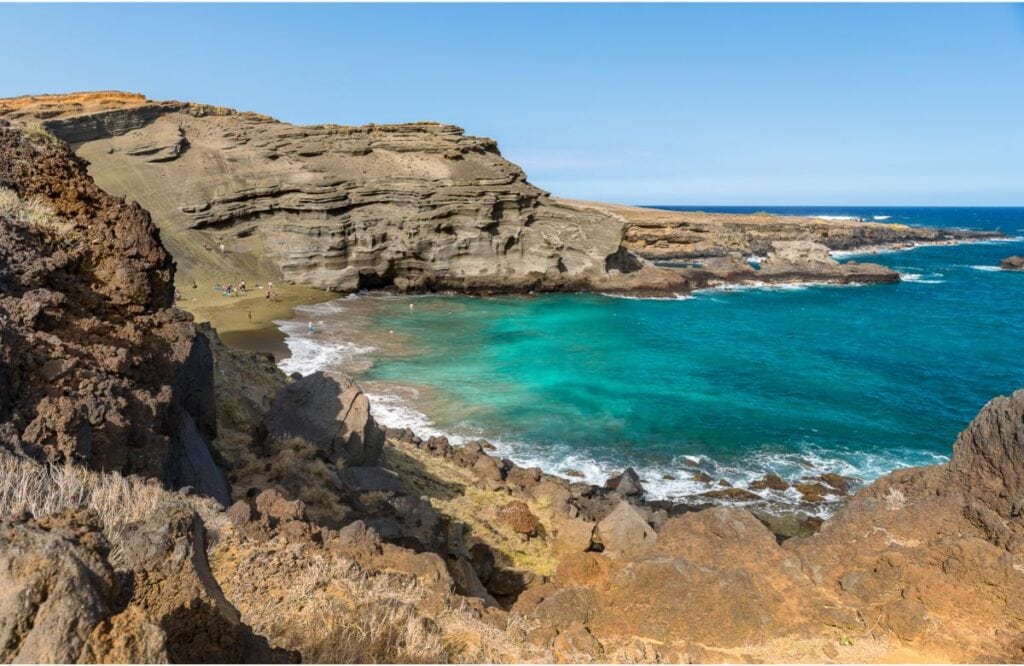 Papakōlea Green Sands Beach is one of the best things to do on Big Island Hawaii compared to Maui.