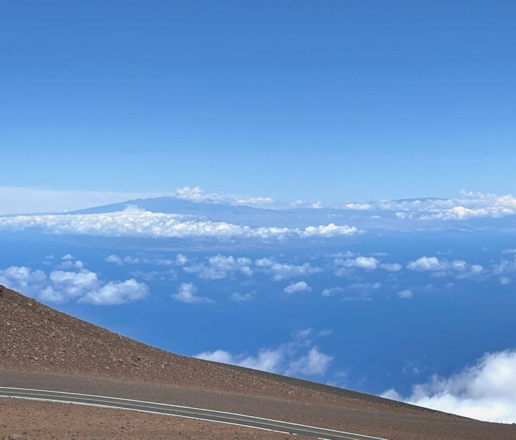 Driving at Haleakala National Park, where the roads take you above the clouds for spectacular views of the island of Maui