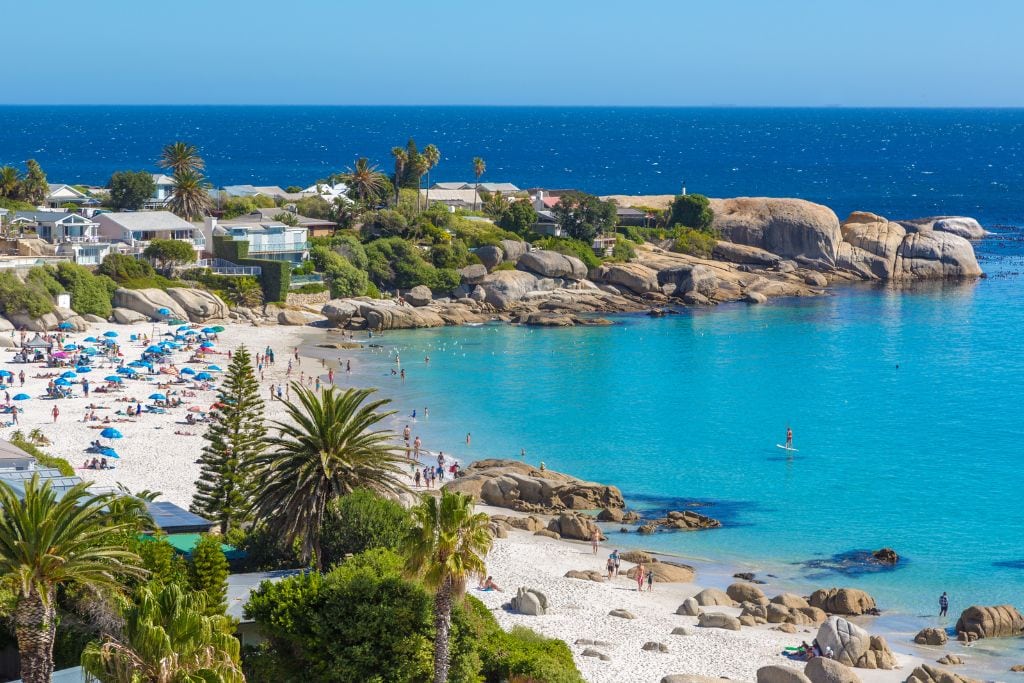 Camps Bay Beach in Cape Town, one of the reasons to visit Cape Town vs Johannesburg