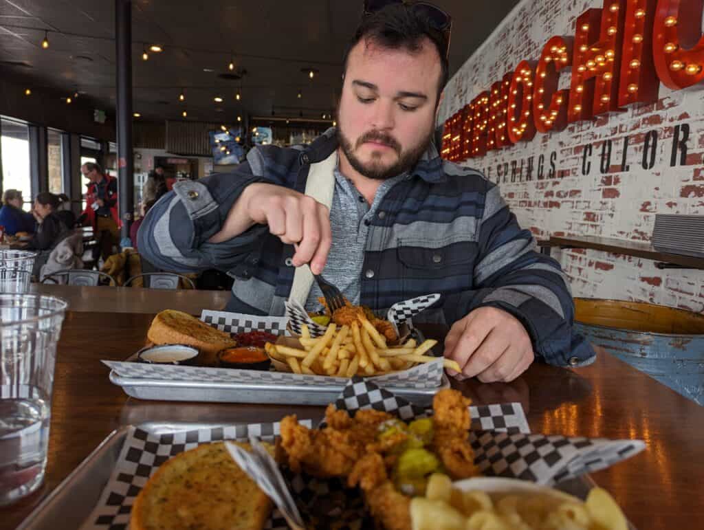 Mike eating Hypnotic Chicken in Steamboat Springs, Colorado