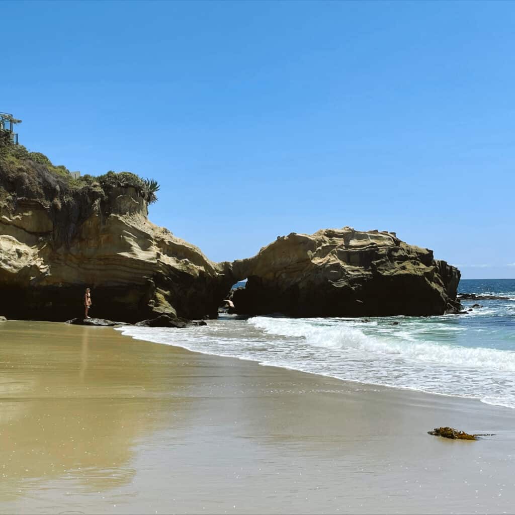 A view of the beach in Laguna and the with the natural rock arch formation.