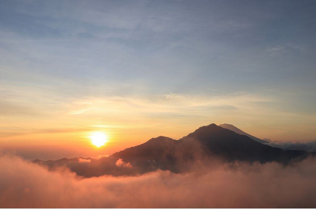 mt. batur in bali in the clouds at sunrise