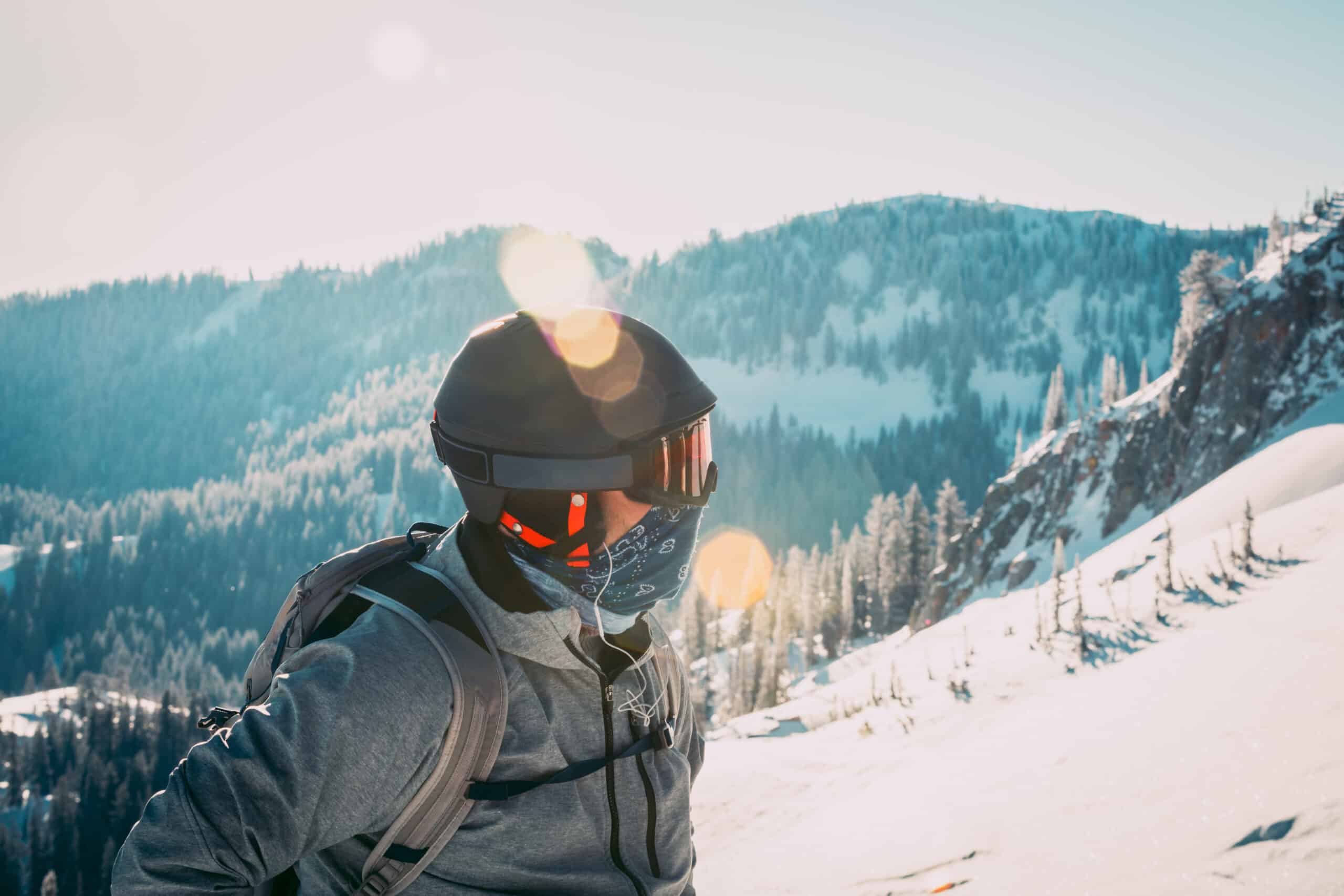 A skier with a ski mask on the mountain.