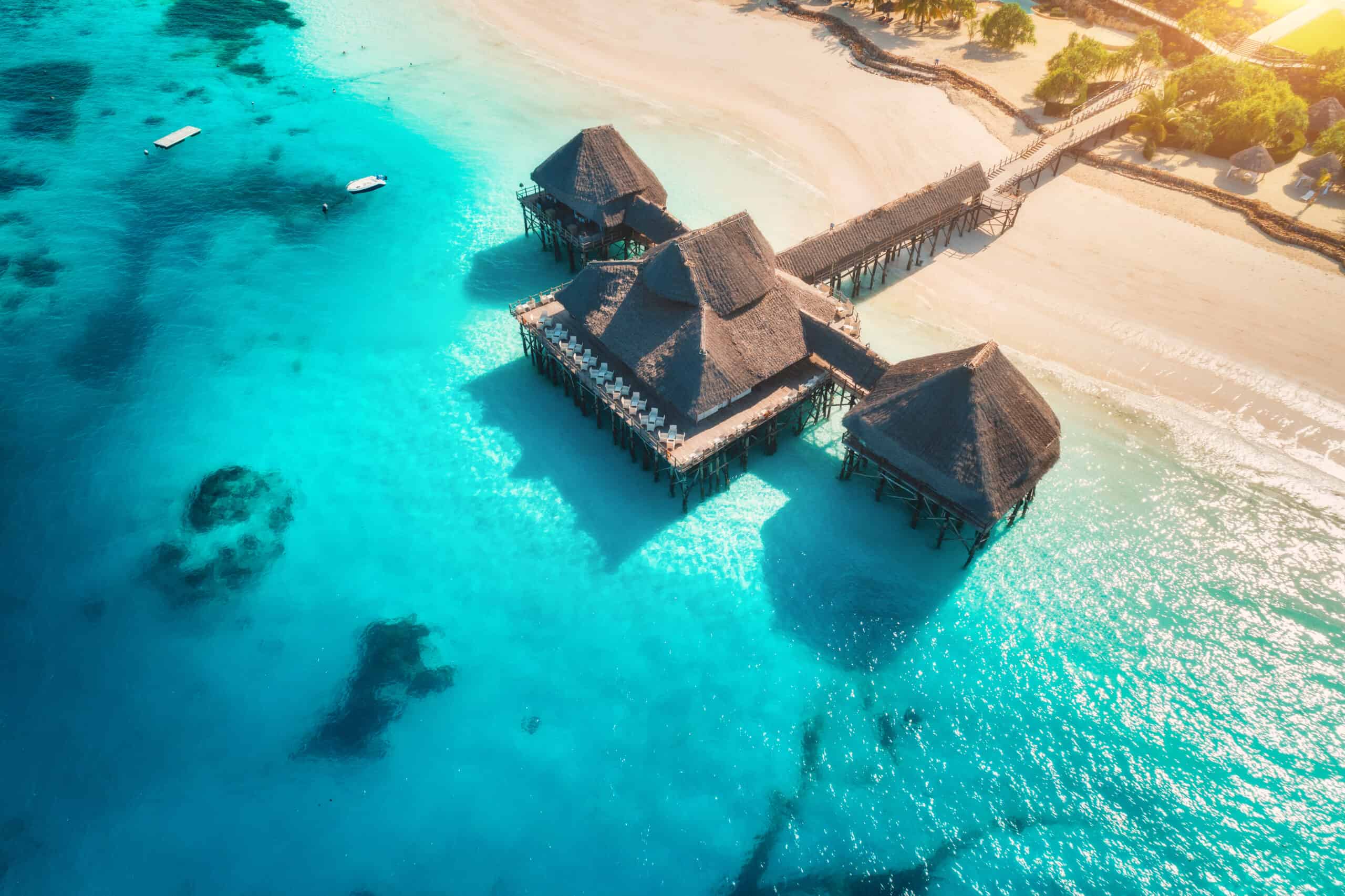 An aerial shot of an overwater bungalow in Zanzibar, Tanzania.