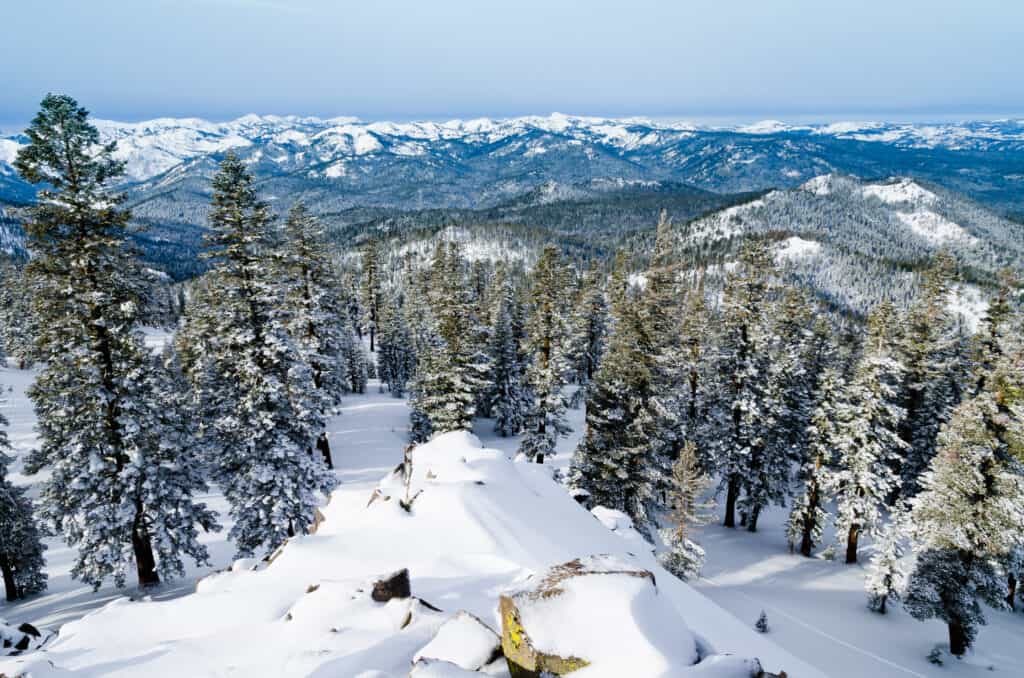 A view over the snowcapped mountains from the top of the run at Northstar California.