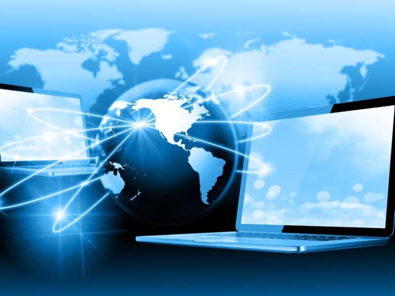 A picture of a computer and the globe behind it.