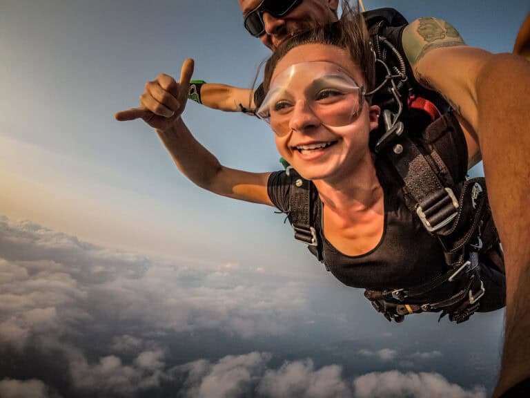 Emily skydiving above Europe.