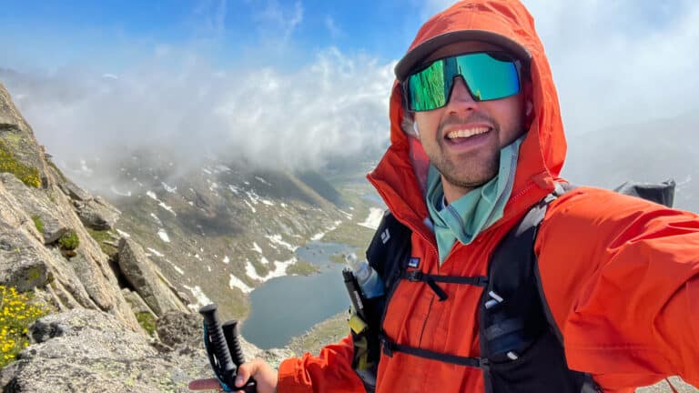 A picture of Chad Lubinski at the top of a mountain.