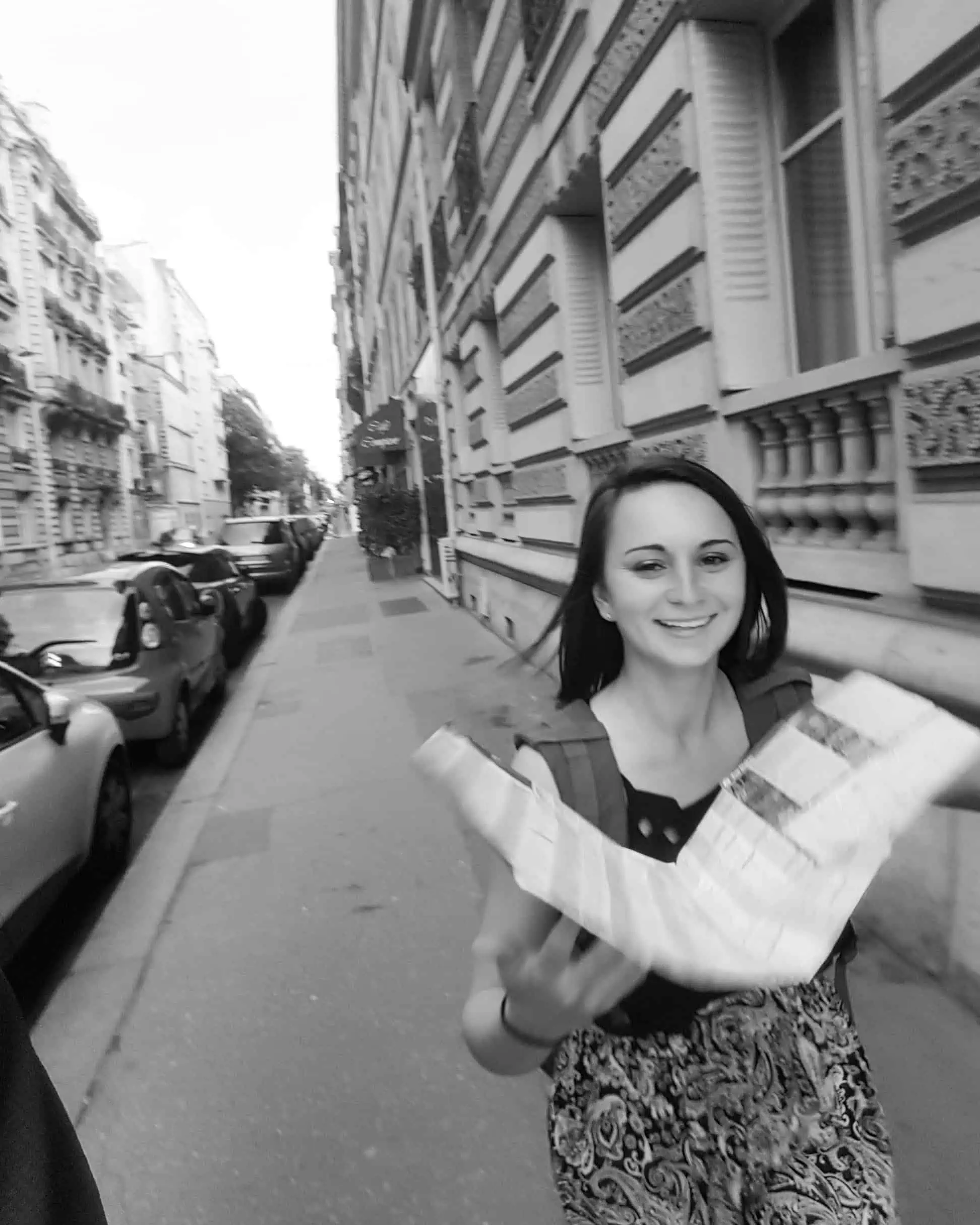 Emily using a map to find her way through an unfamiliar city.
