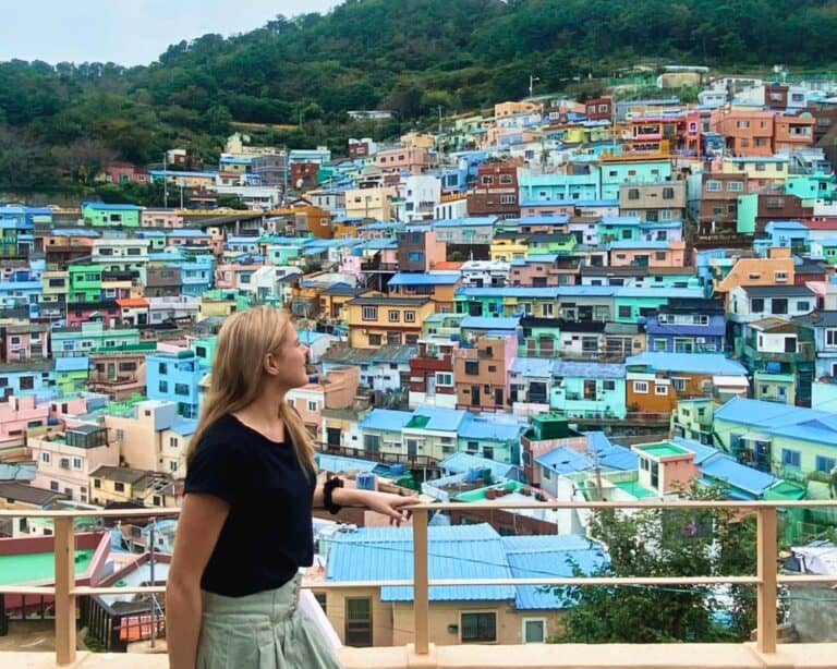 Olivia Mcdonald looking out at the colorful houses of Busan, South Korea
