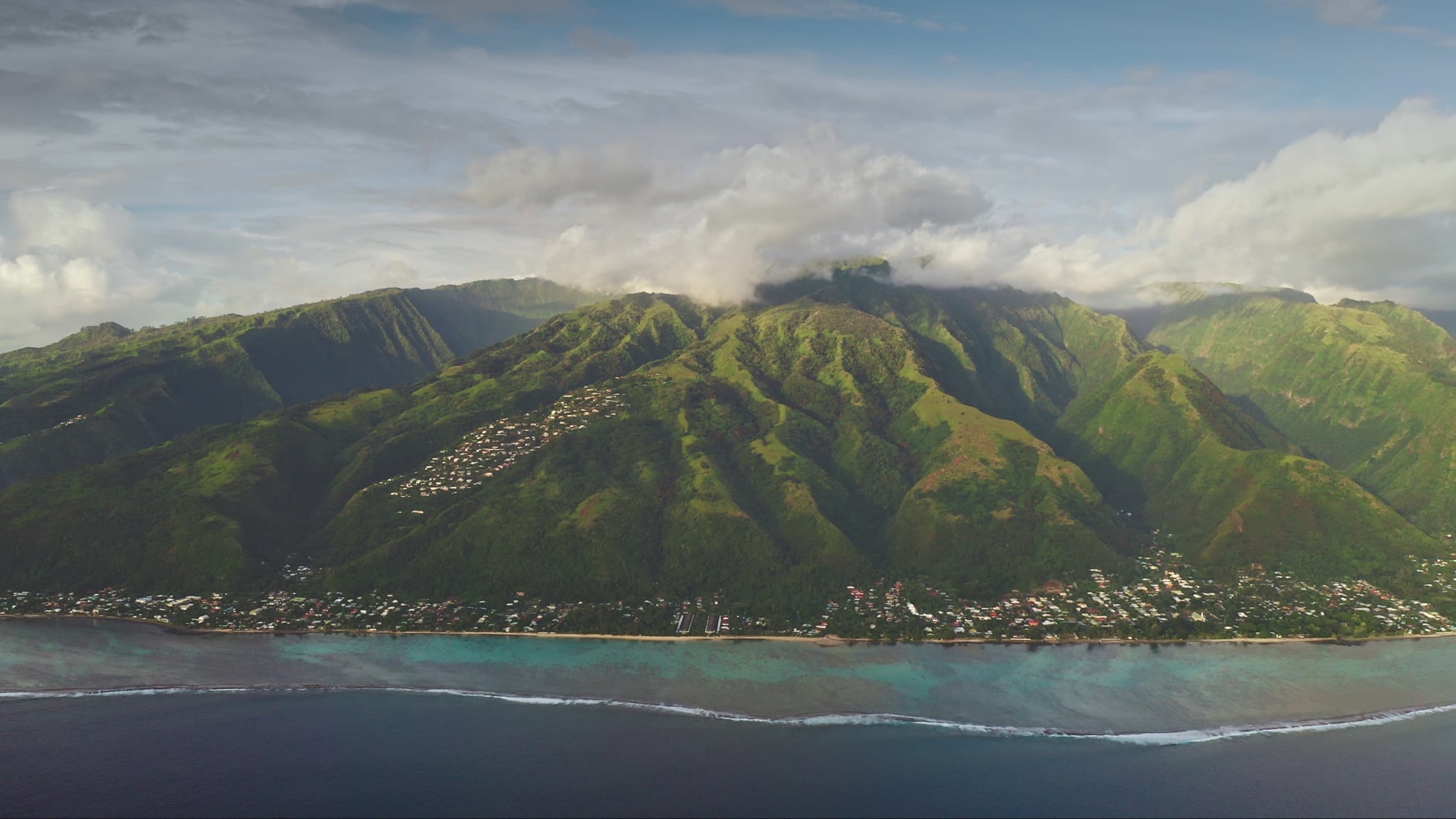 Green mountains along the coast of Tahiti